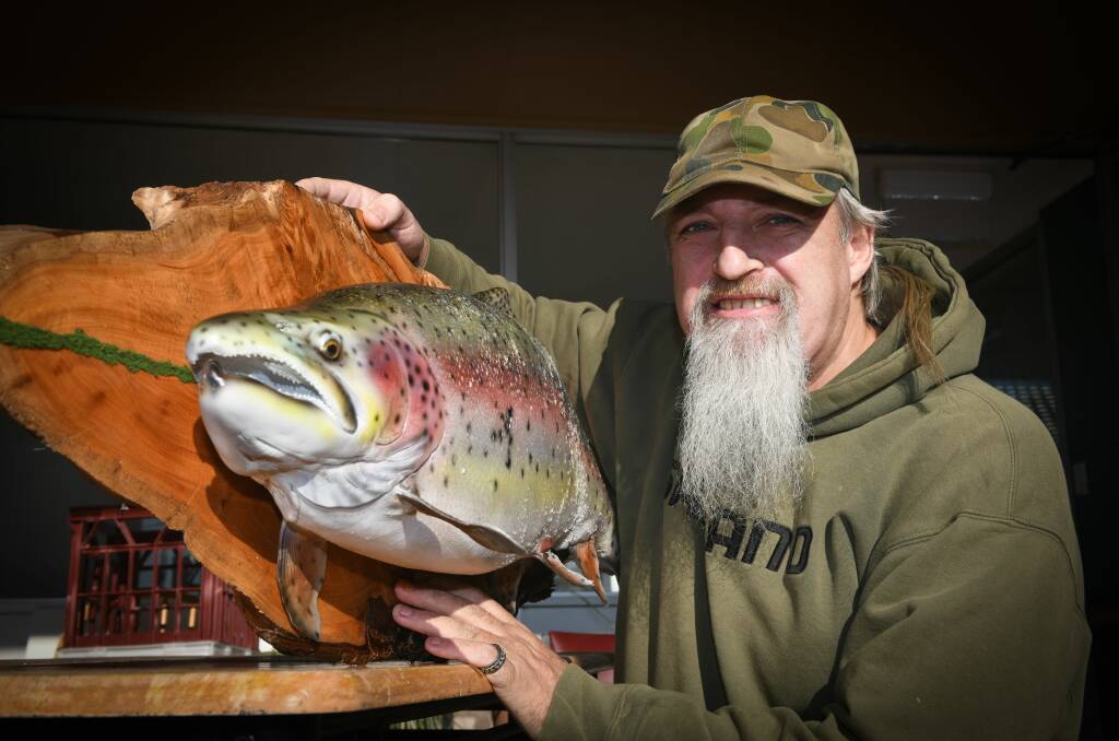 SHOWPIECE: Scott Heerey shows off his 24lb rainbow trout. Picture: Paul Scambler