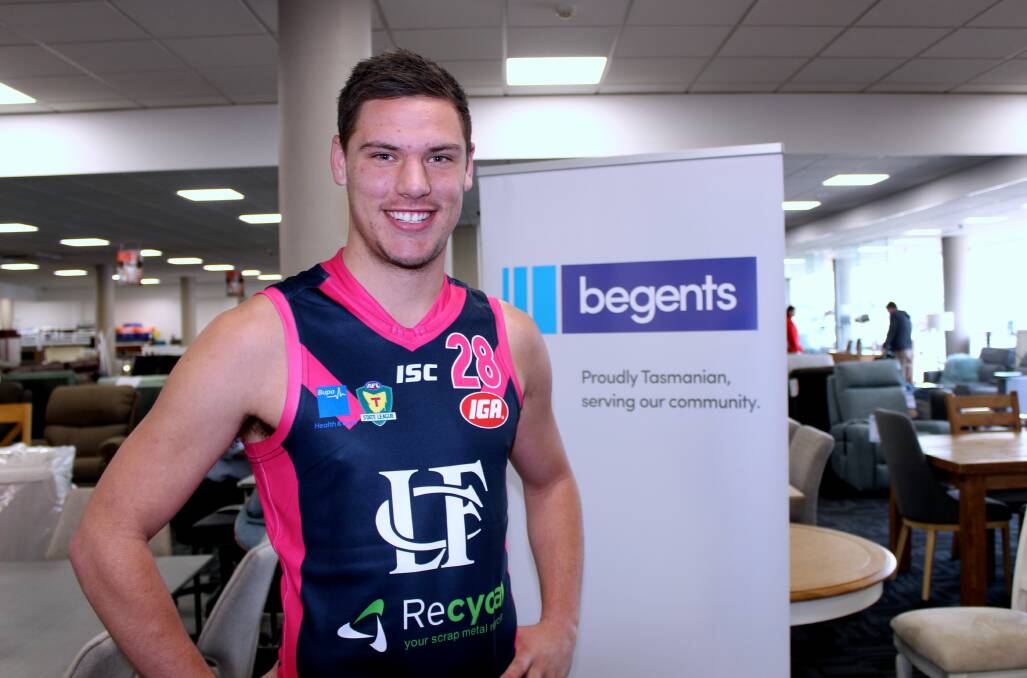 NOT SO BLUE: Winger Casey Brown shows off the pink kit Launceston will wear on Saturday. Picture: Hamish Geale