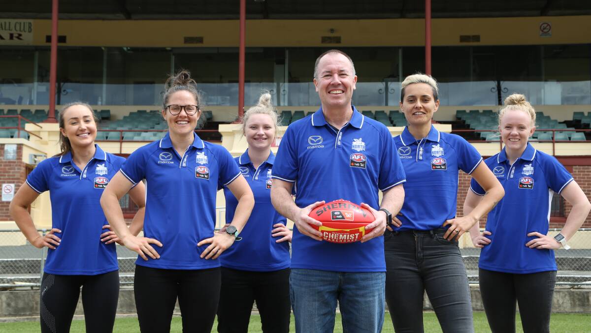 TASMANIA BOUND: North Melbourne's Nicole Bresnehan, Emma Kearney, Daria Bannister, coach Scott Gowans, Mo Hope and Emma Humphries. Picture: Supplied