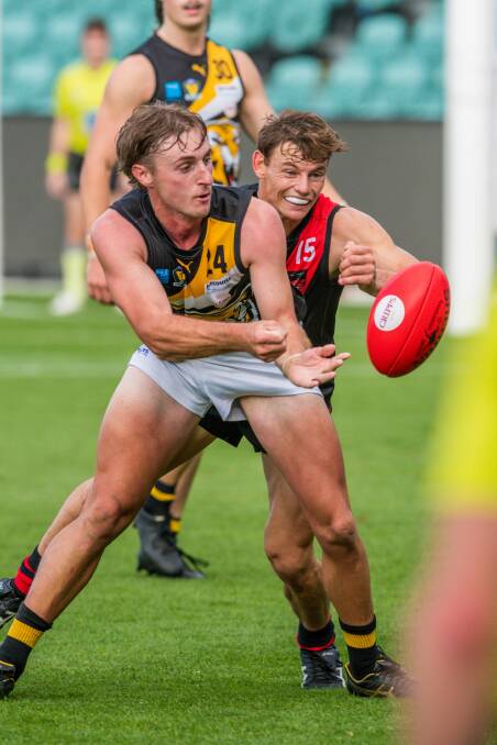 AVENT YOU DONE WELL: Blake McCulloch and Jack Avent do battle at UTAS Stadium last month. 