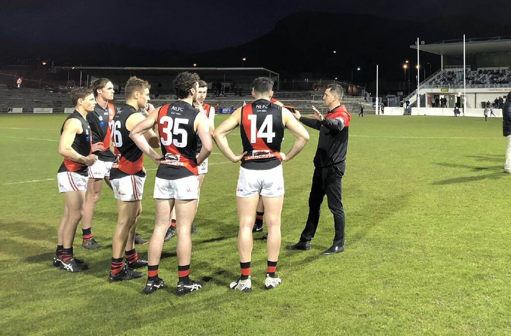 GATHER ROUND: North Launceston's defensive group takes instruction from Scott Stephens. Picture: Twitter