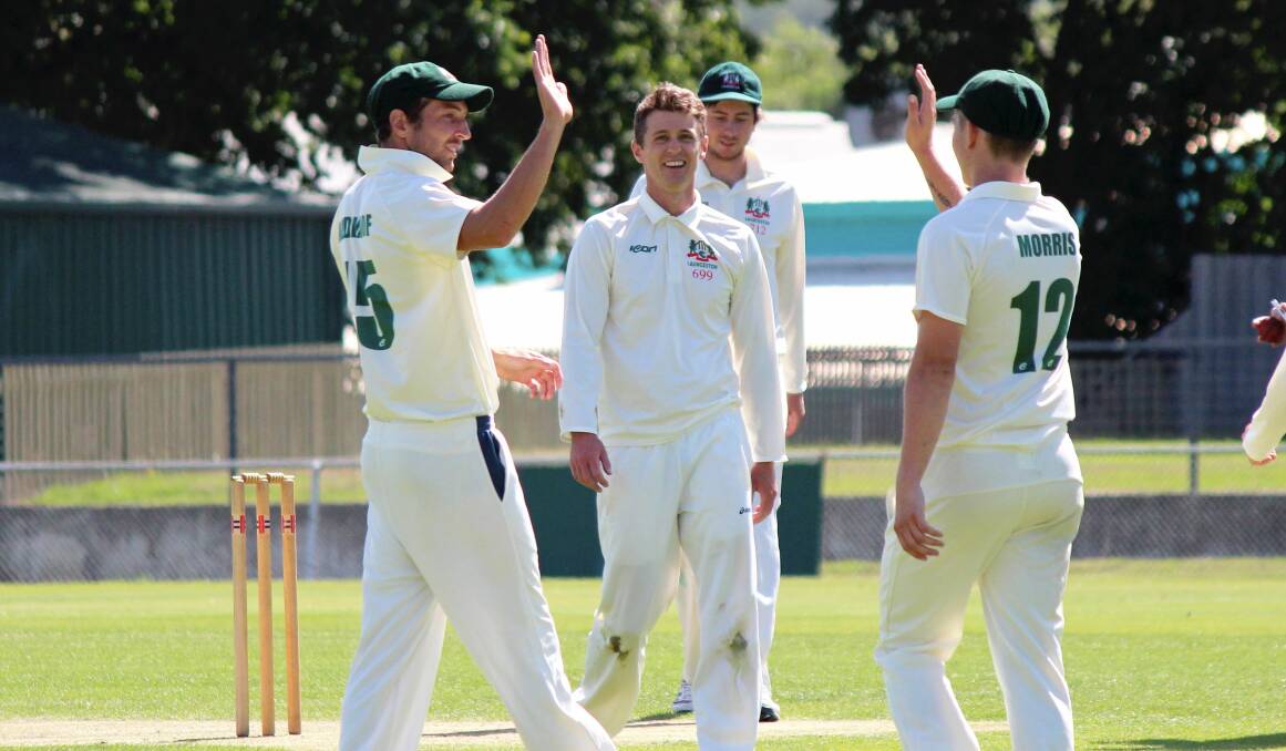 HIGH FIVE: Zac Oldenhof and Jakeb Morris celebrate with wicket-taker Cam Lynch (centre) against Westbury. Picture: Hamish Geale