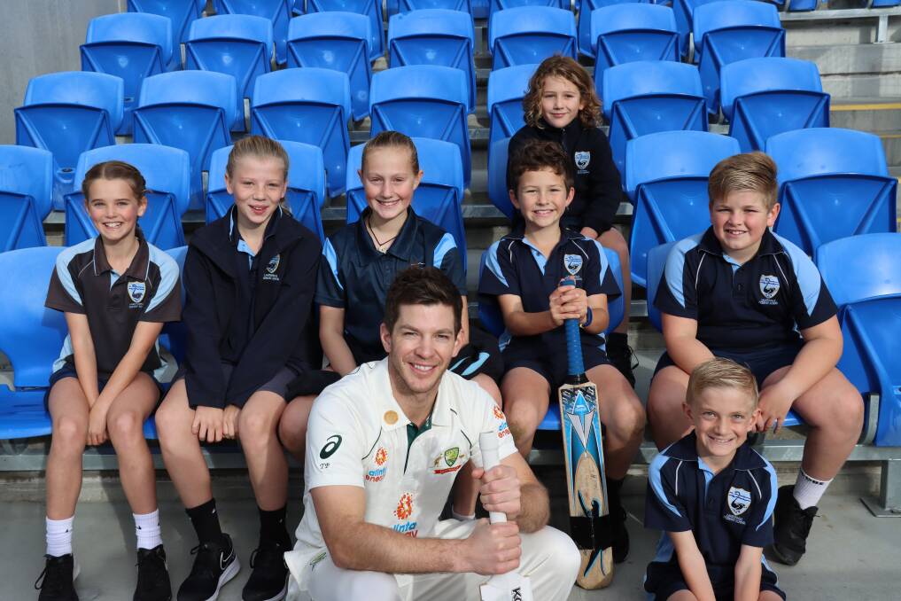 THEN AND NOW: Australian captain Tim Paine at Bellerive Oval with students from his old school, Lauderdale Primary. Pictures: Cricket Tasmania