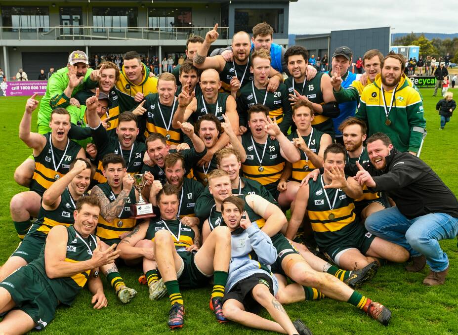 SAINTS SALUTE: St Pats celebrate their fifth reserves premiership in six years. Picture: Phillip Biggs