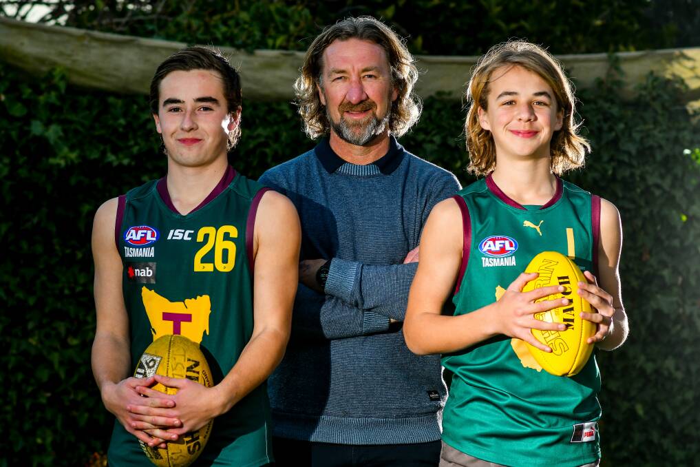 FOOTY FAMILY: Ollie, Adam and Ryley Sanders. Ryley will make his senior debut in Saturday's trip to Kingborough.