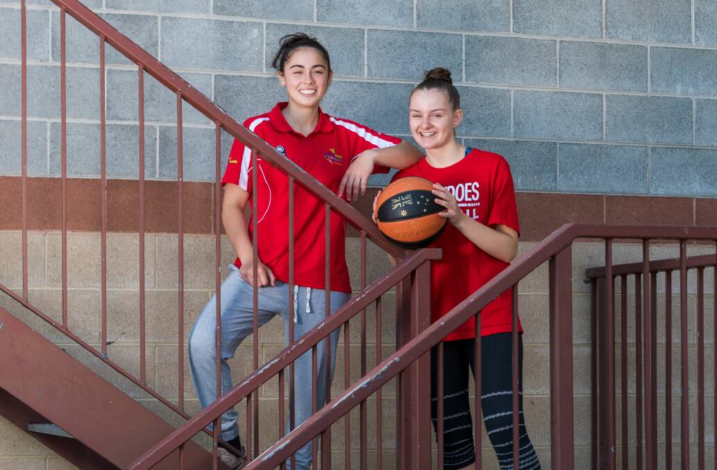 TASMANIAN TEAMMATES: Young Tornadoes basketballers Aishah Anis and Micah Simpson. Picture: Phillip Biggs