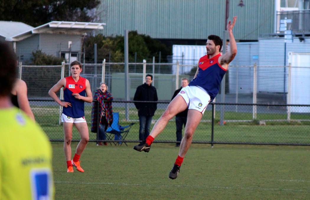 FLYING: Colin Garland finished with six goals in a tight North Hobart win. Picture: Hamish Geale 