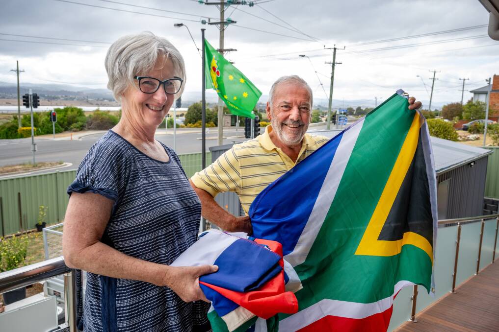 Judy and Steve Timmins with the South African flag. Picture by Paul Scambler