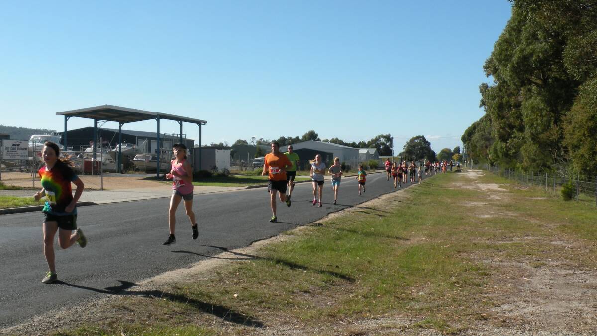 STRIDING OUT: The field works its way up Tully Street at the St Helens Anzac Fun Run on Saturday. Picture: Supplied
