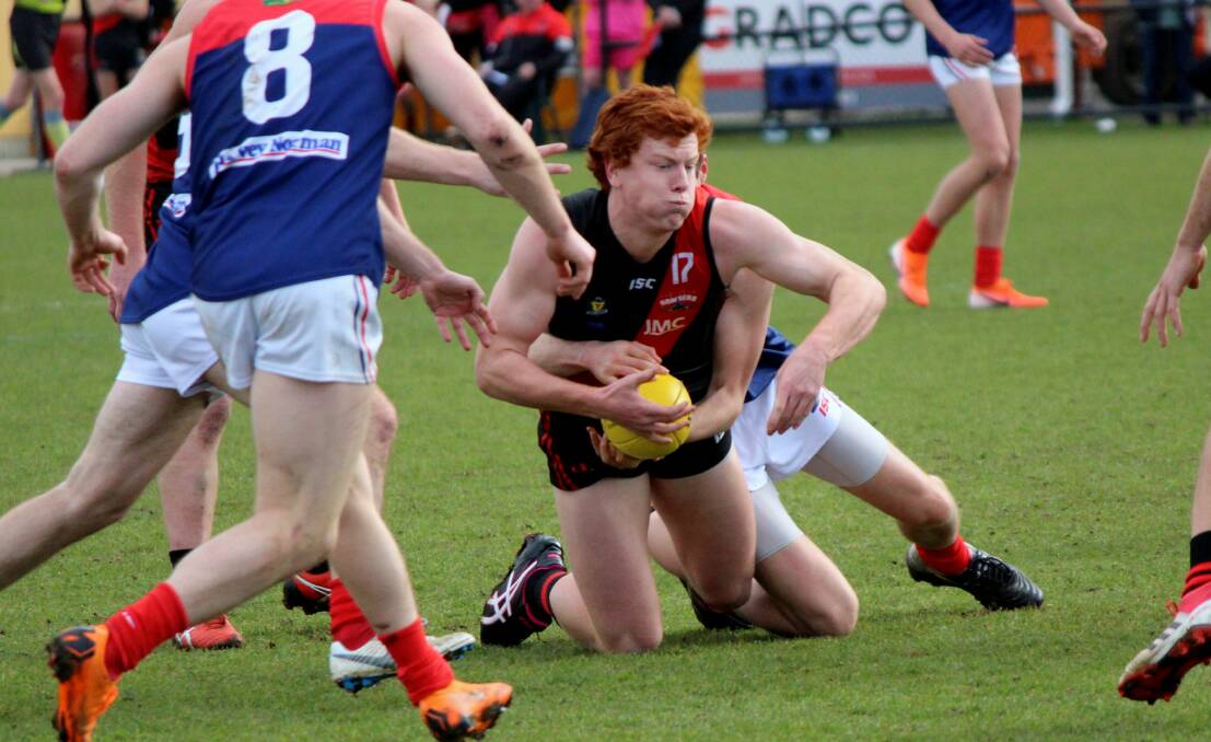 TRAPPED: North Launceston defender Tom Donnelly. 