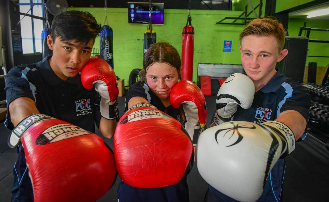 GLOVES ON: Ali Akabar, 17, Charlie Sebastian, 18, and Lucas Crack, 17 will represent Launceston PCYC in South Australia next weekend. Picture: Paul Scambler
