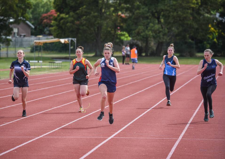 PHOTO FINISH: Cressy's Chloe Jarman (centre) edges out the grade 10 girls' 200m from (left to right) Port Dalrymple's Megan Wilson-Carlson, Scottsdale's Hollie Singline, Lilydale's Christie Pentland and Deloraine's Jessie Gibson. Pictures: Paul Scambler