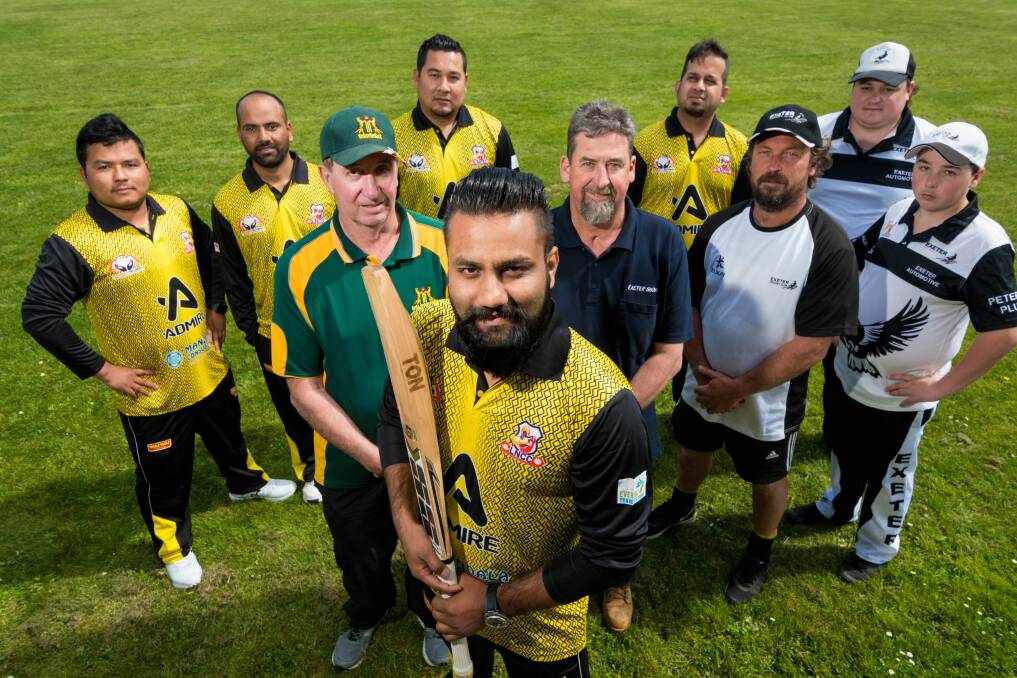 READY TO ROLL: Launceston Nepali Cricket Club team manager Roshan Dallakoti with team members, TCL president Darrell Whyte, Exeter Show Society's Phil Goss and Exeter players. Picture: Phillip Biggs 