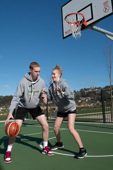 PUMPED: Launceston brother and sister talents Lachlan and Sophie Brewer engage in some rare one-on-one combat at Riverbend Park. Pictures: Paul Scambler 