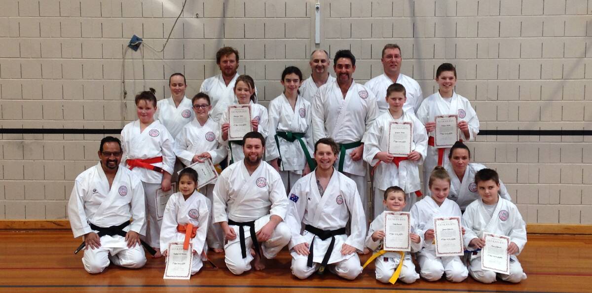 BELTED UP: Newly-graded Go Kan Ryu athletes show off their certificates. Participants put in up to a year of training to move to the next grading.