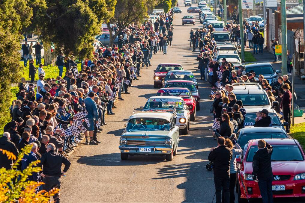 SHOW OF RESPECT: The streets were lined as hundreds gathered to pay their respects to Ian Beechey on Saturday morning. Picture: Phillip Biggs