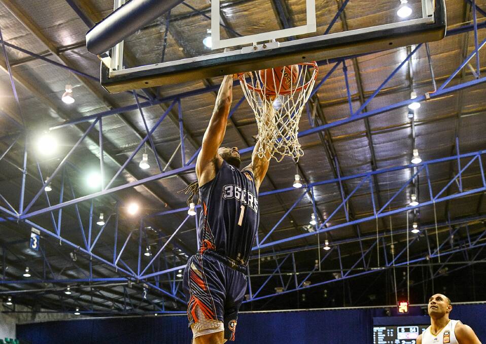 SLAM DUNK: Adelaide's Obiri Kyeidunks during the NBL Blitz pre-season competition at the Silverdome this year. Picture: Scott Gelston