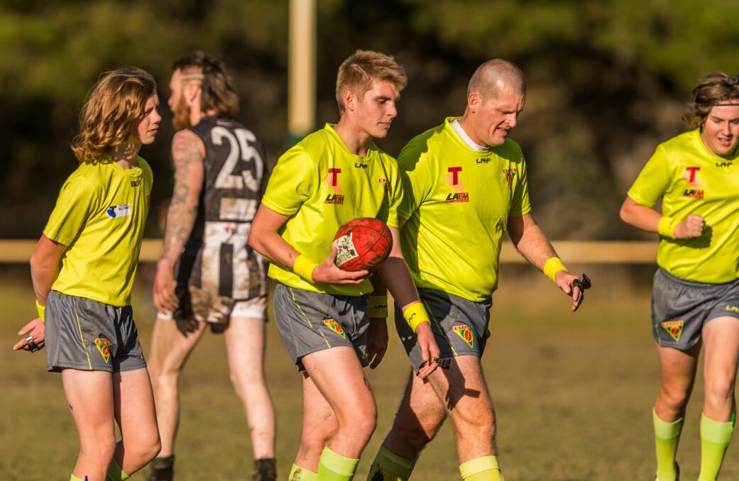 Fellows carries the ball off during his senior debut in the NTFA's first division last year