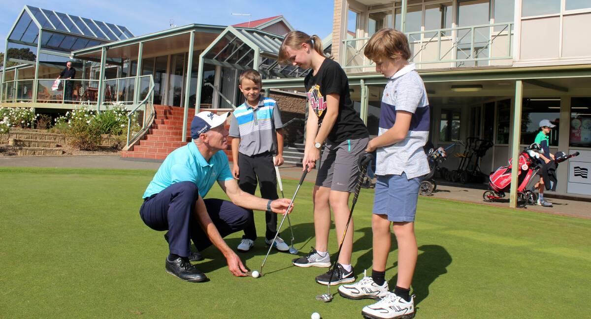 TIPS: Golf coach Peter Knight with Campbell Targett, Lily Faulkner and Henry Marston. Picture: Hamish Geale
