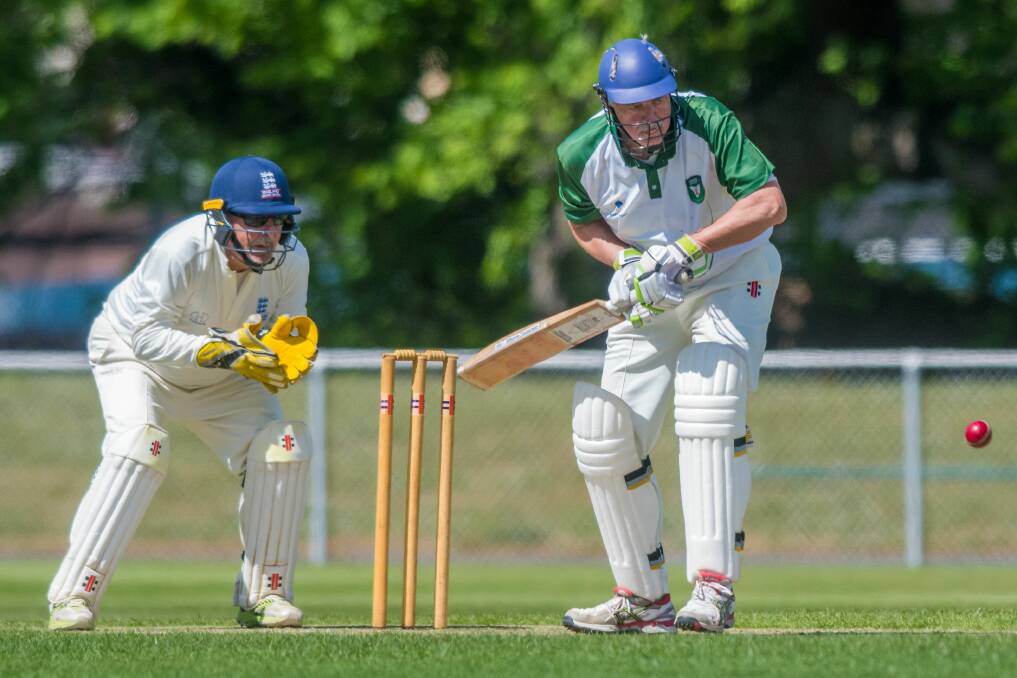 LIKE A HAWK: UK over-60s wicket-keeper Chris Tarrant watches on as Tasmania-Victoria Invitational XI batsman Dave Cordy keeps a keen eye on the ball at the NTCA Ground. Picture: Phillip Biggs 