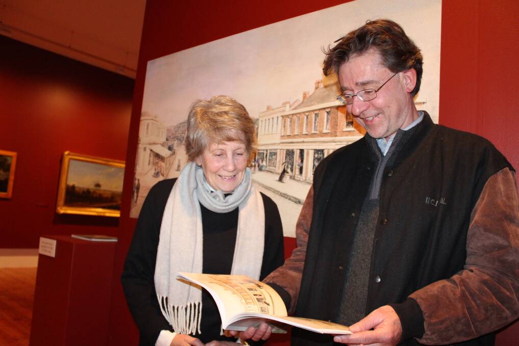 HISTORY THROUGH ART: QVMAG publications coordinator Andrew Parsons and honorary research associate Yvonne Adkins. Picture: Hamish Geale 