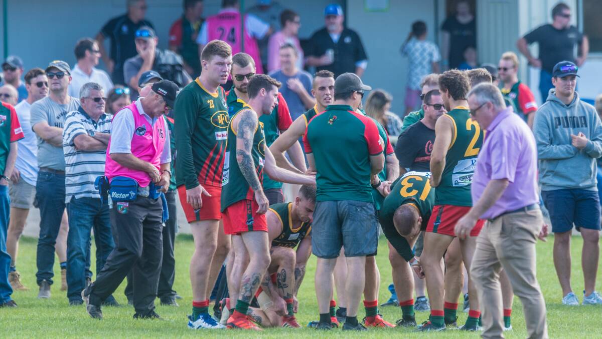 LINE BY LINE: Bridgenorth players talk tactics at quarter time of their clash with South Launceston. 