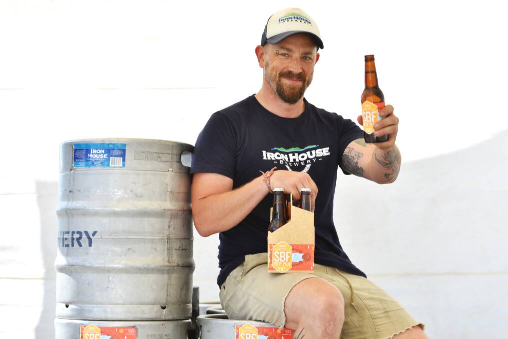 CHEERS FOR BEERS: Iron House beerologist Craig Spilsbury cracks open an SBF 50+ beer ahead of this weekend's Esk Beerfest. The festival will be held on Friday and Saturday on Esplanade and Shields Street. Picture: Scott Gelston  
