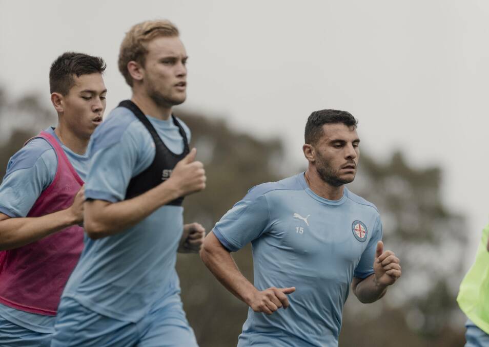 Nathaniel Atkinson and Andrew Nabbout at training.