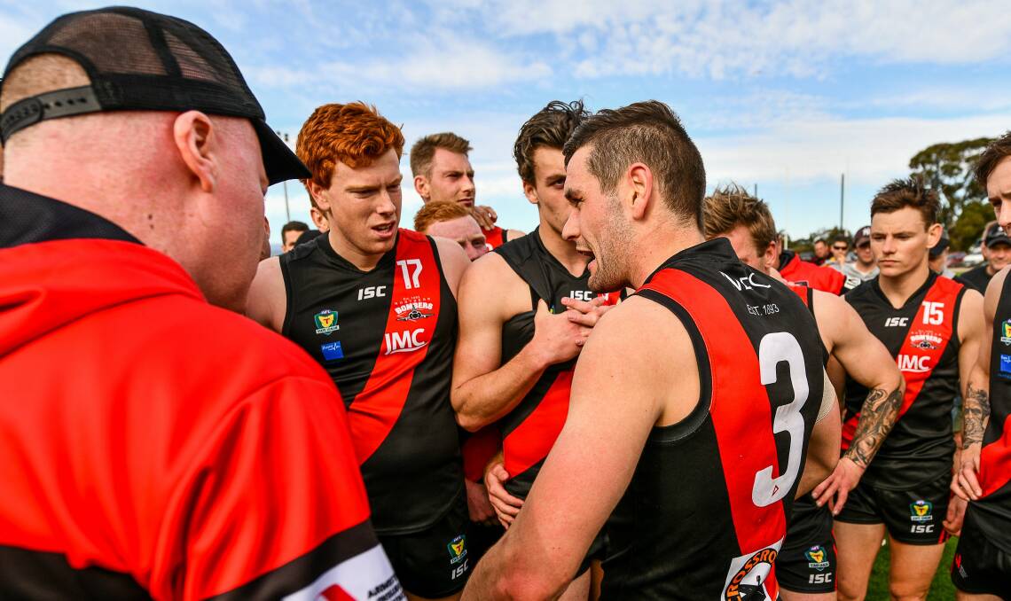 GATHER ROUND: North Launceston coach Taylor Whitford addresses his players during last season's successful State League finals campaign. Picture: Scott Gelston