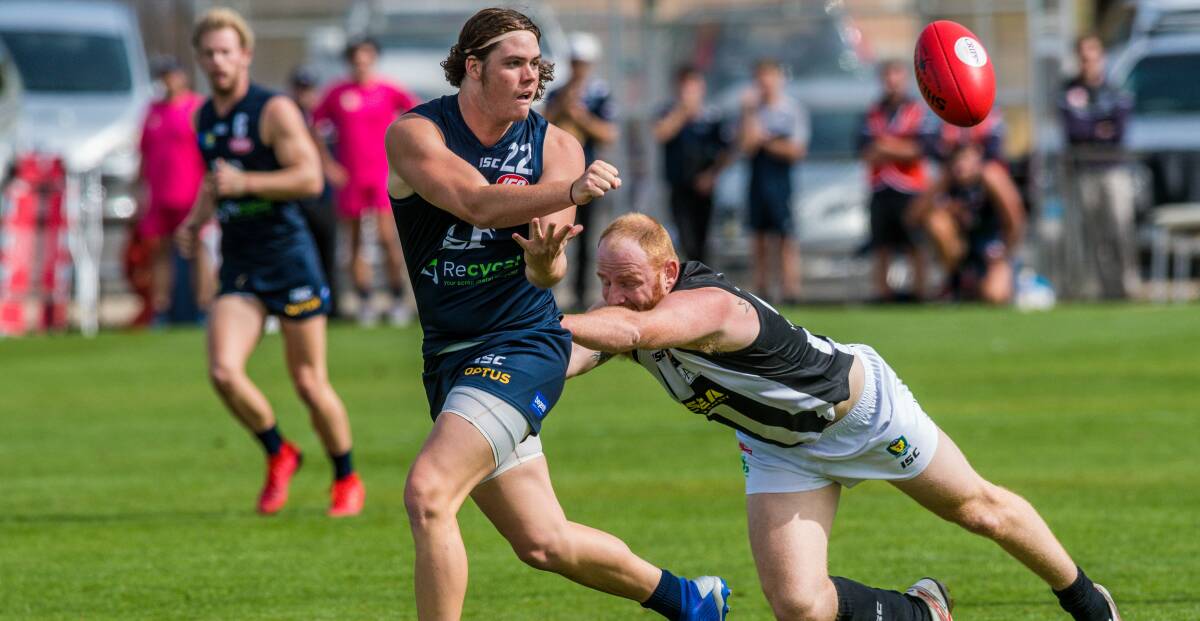 JUST IN TIME: Launceston tall Ethan Conway gets a handball away under pressure in Launceston's 29-point opening round loss to Glenorchy. Picture: Phillip Biggs
