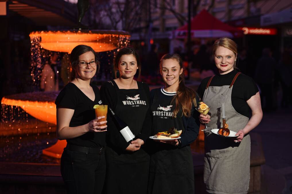 GOURMET WELCOME: Holy Guacamole's Freya Allen, Wursthaus at Olivers' Isabel Johnson and Georgie Shepherd, and The Dinner Belle's Georgie Galloway at the Quadrant Mall's official opening. Picture: Scott Gelston