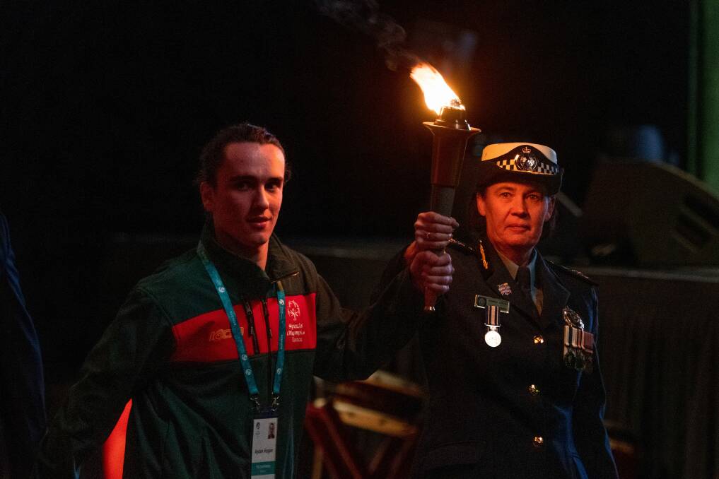 Ms Adams and athlete Aydan Hogan lit the cauldron at the Special Olympics in Launceston late last year. 