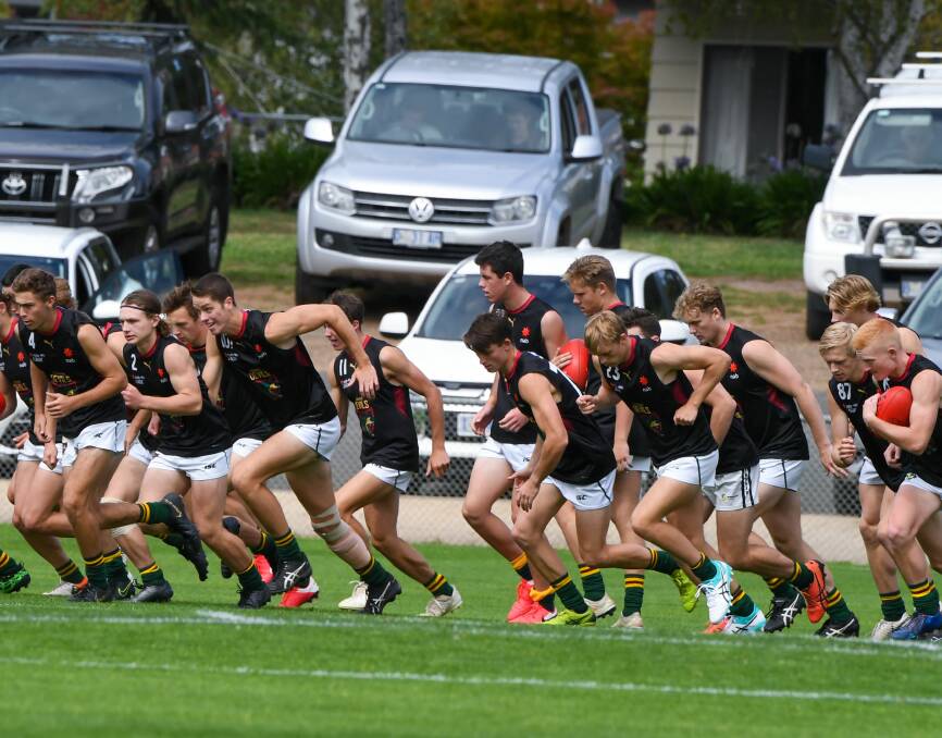 WAITING GAME: This year's Tassie Devils in action during pre-season earlier this year. Picture: Neil Richardson