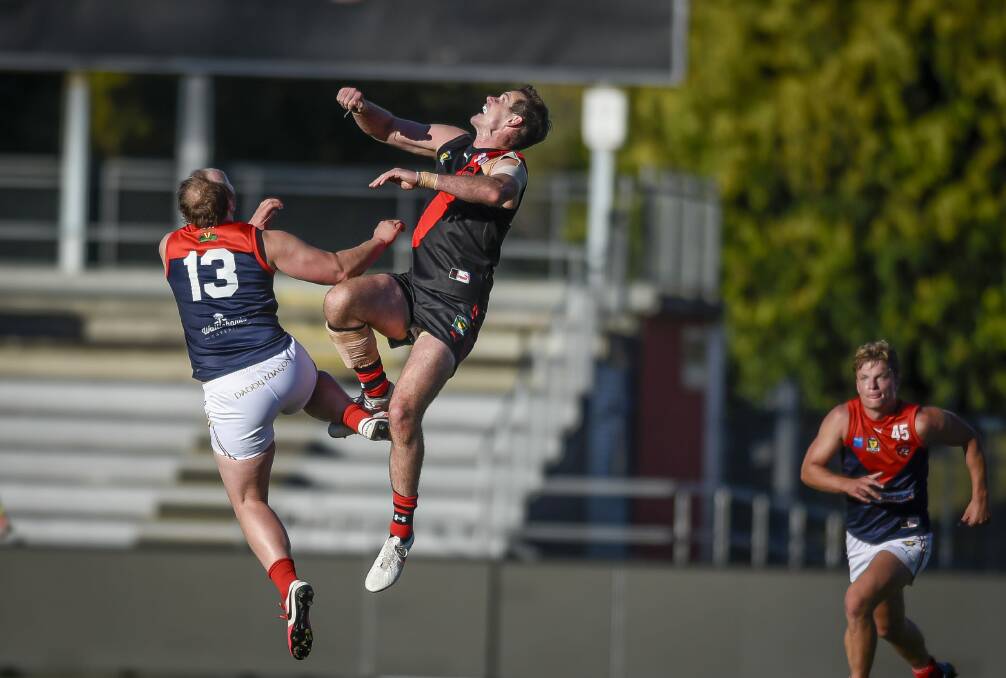 AERIAL DUEL: Nathan Hardy and Alex Lee go head to head in the ruck. Lee was one of the Bombers' best in a 20-point win. 