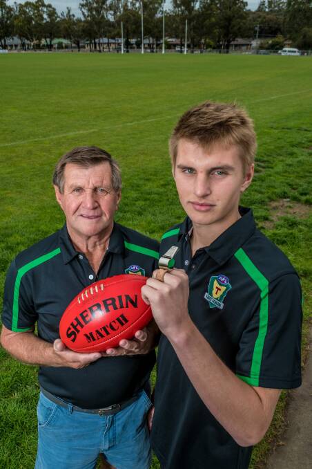 LIKE FATHER: Legendary umpire Terry Fellows with son Casey ahead of the latter's TSL senior debut this year. 