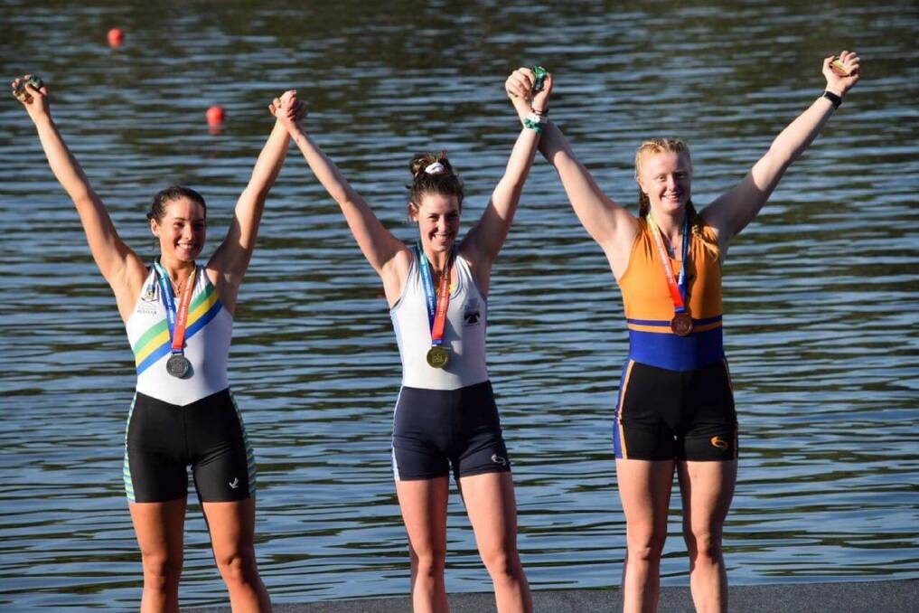 WINNER'S SALUTE: Launceston 17-year-old Bec Bye (centre) celebrates her win in the under-19 women's single scull. Picture: Supplied