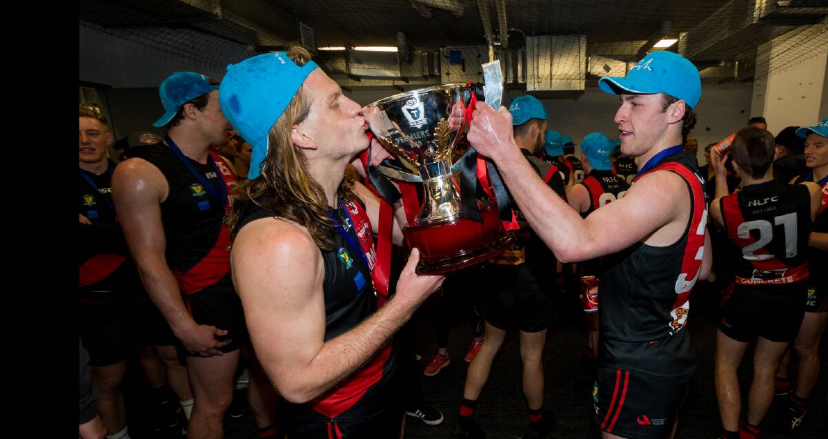 Davies and Fletcher Bennett with the premiership cup. 