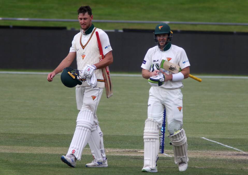 VICTORIOUS: Beau Webster and Tim Paine walk off after snatching victory in the Sheffield Shield.