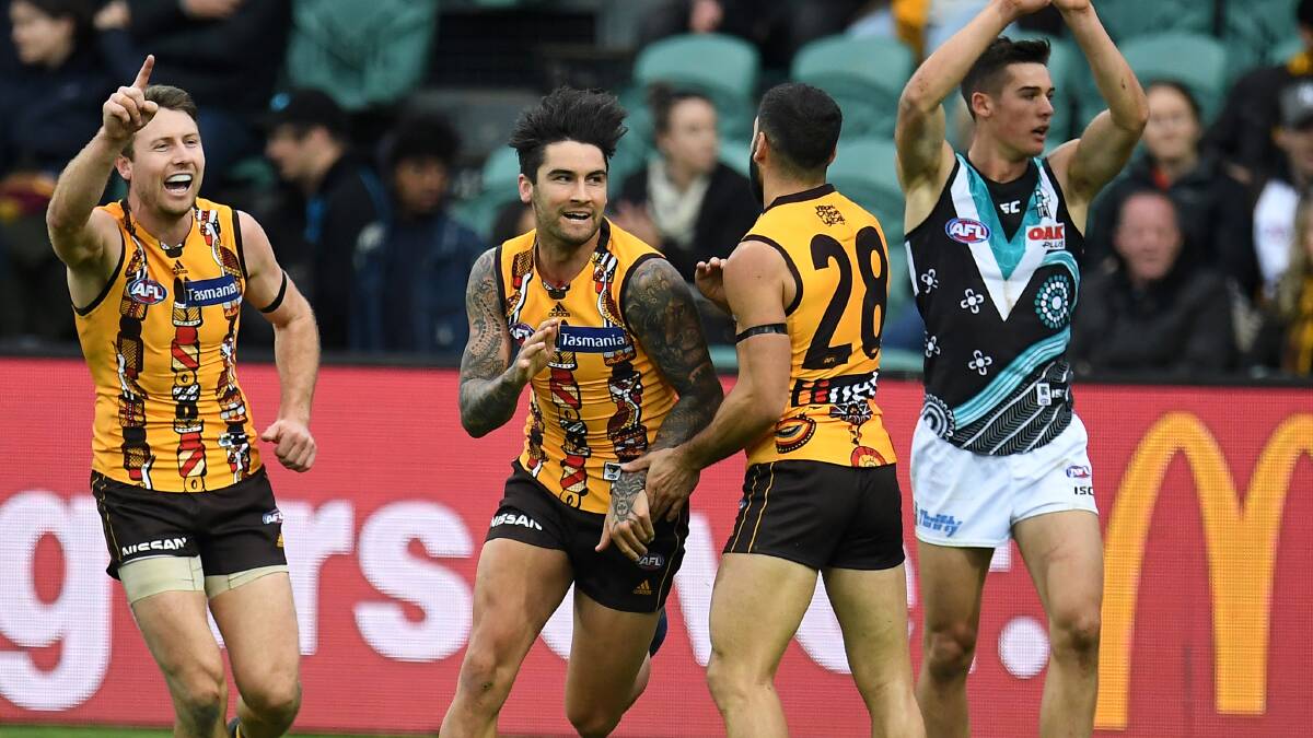 FAMILIAR FACE: Hawks recruit Chad Wingard celebrates after snapping one through late in the third term. The goal was overturned, but the 25-year-old still finished with 20 touches - his most as a Hawk. Pictures: AAP 