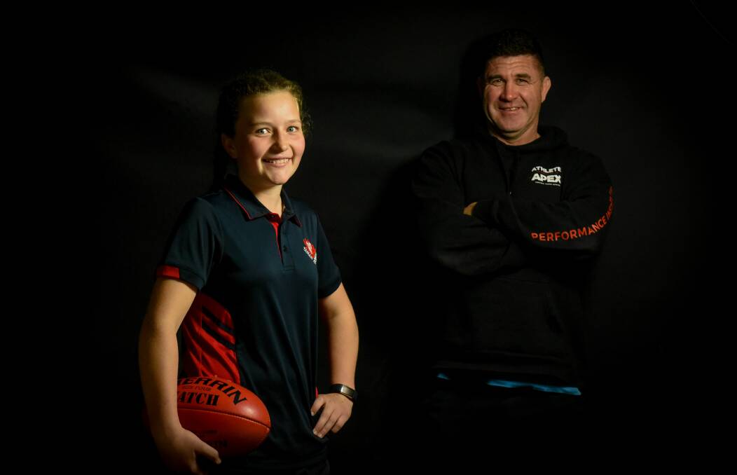 SUPERBOOT: Rowella 13-year-old Daizi Blundstone with Tamar Demons coach Dwayne Beeton. Blundstone was Beeton's main forward threat as Tamar took out the NTJFA girls' 14-17 premiership. Picture: Paul Scambler