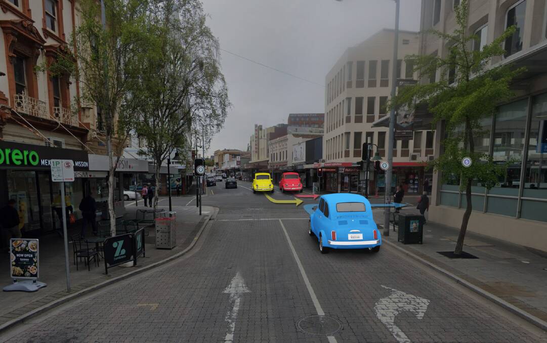 At the corner of Brisbane and George streets, the blue car must give way to the yellow car. 