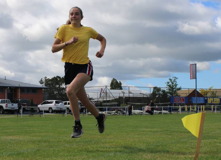 Eleanor Renton races ahead in the grade 10 girls' 400m.