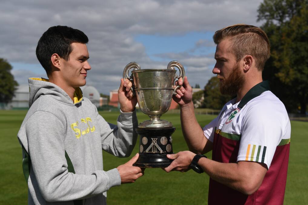 ONE HAND ON THE TROPHY: Grand final captains Alec Smith and Richard Howe get familiar with the premiership cup. Picture: Paul Scambler 