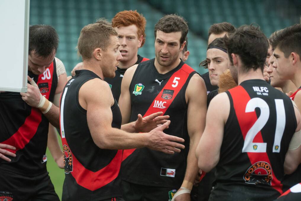TACTICS: North Launceston coach Brad Cox-Goodyer addresses his playing group. The Bombers have won seven straight to sit second on the State League ladder. Picture: Paul Scambler