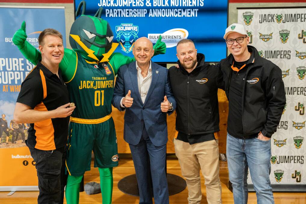 ON THE MARCH: NBL owner Larry Kestelman (centre) poses with Jack the Jumper and Bulk Nutrients staff. Picture: Supplied 