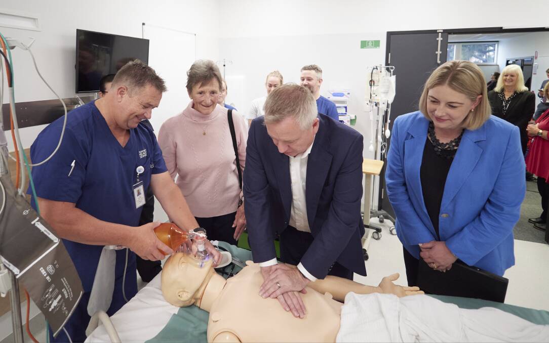Premier Jeremy Rockliff applies life giving attention to mannequin 'Nigel' with direction from life support coordinator Craig Shennan, Anne O'Byrne, and Health Department secretary Kathrine Morgan-Wicks. Pictures by Rod Thompson