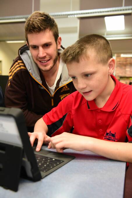 Birchall with Invermay Primary student Ryan Roberts. 