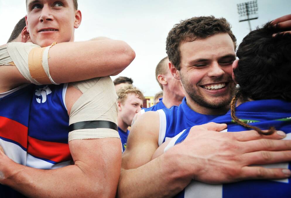 ... and with South Launceston teammates following the 2013 TSL premiership.