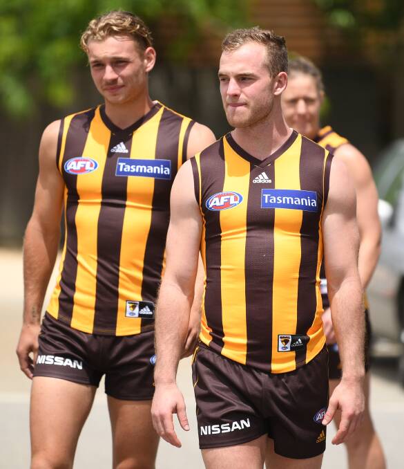 MIDFIELD JETS: Worpel rubs shoulders with Tom Mitchell before the latter broke his leg in pre-season. Picture: AAP