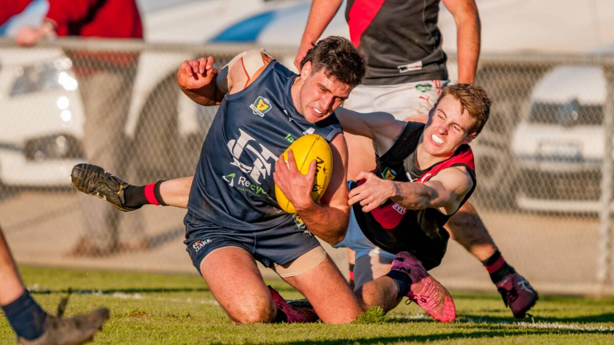 CLOSE QUARTERS: Launceston's Alec Wright shrugs off a tackle in the most recent Northern derby. Picture: Phillip Biggs